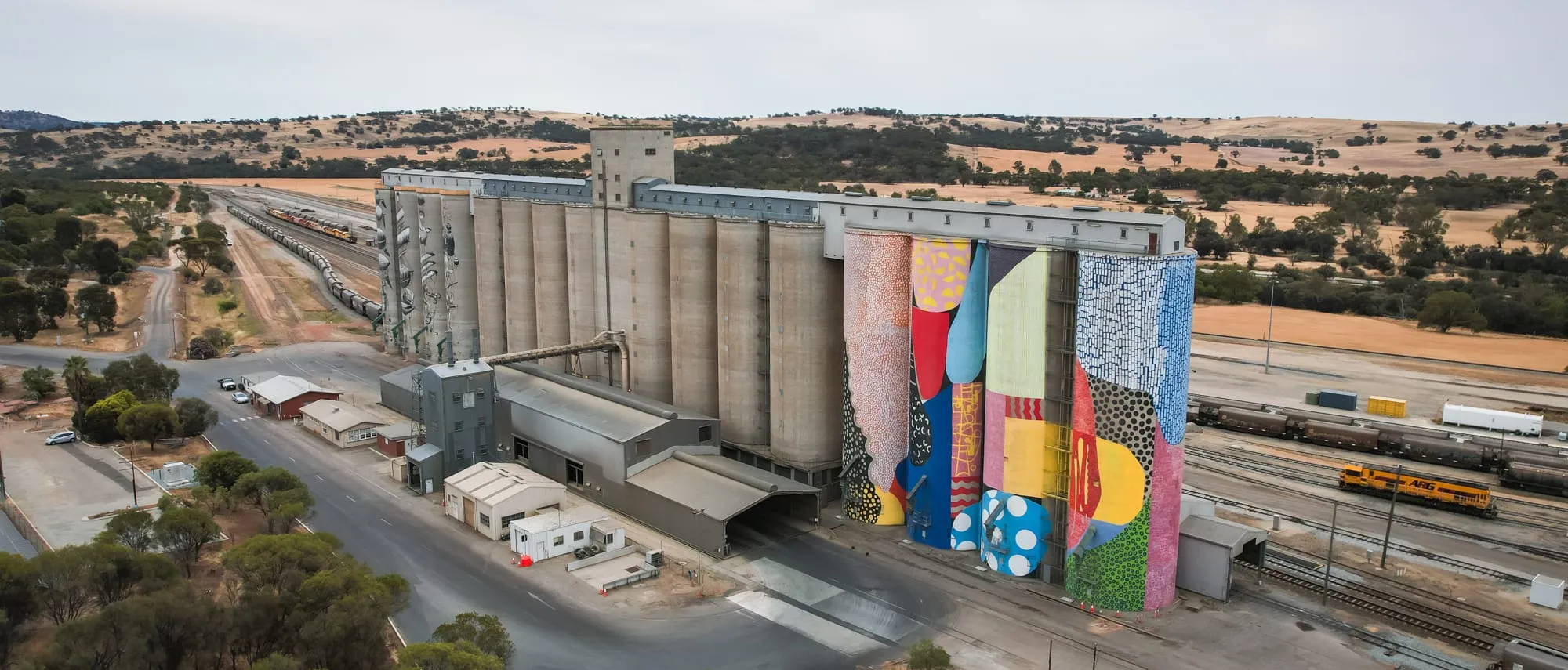 One of the giant grain silos transformed into a mural along WA's Public Silo Trail.